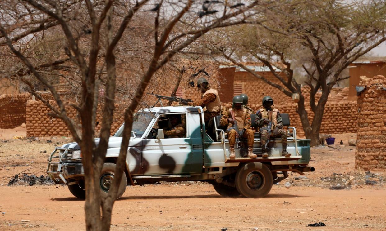 <span>Government soldiers in the village of Gorgadji in northern Burkina Faso. </span><span>Photograph: Luc Gnago/Reuters</span>