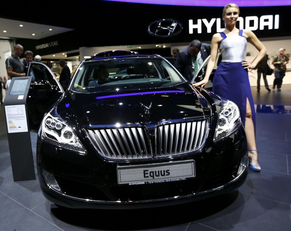 Model poses next to Hyundai Equus car at Frankfurt Motor Show