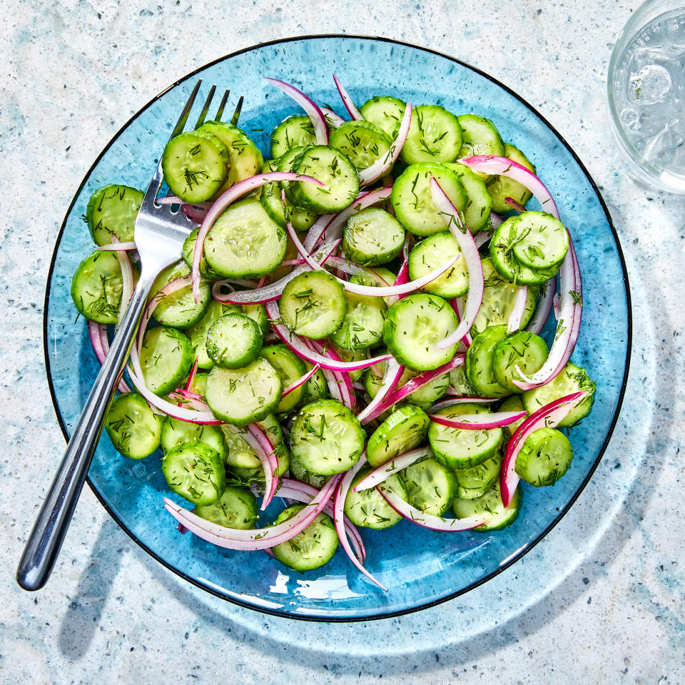 <p>This cucumber vinegar salad has the perfect balance between sweet and sour flavors, plus a hint of fresh dill. The red onion adds nice crunch. Enjoy this salad right after you're done making it or store it away to snack on for later. <a href="https://www.eatingwell.com/recipe/7949982/cucumber-vinegar-salad/" rel="nofollow noopener" target="_blank" data-ylk="slk:View Recipe" class="link ">View Recipe</a></p>