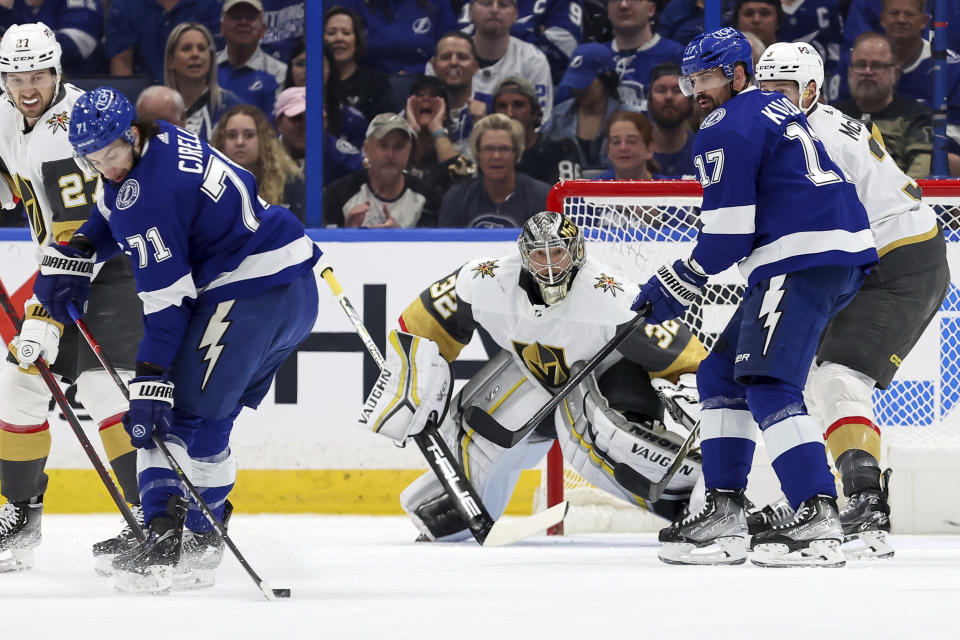 Vegas Golden Knights goaltender Jonathan Quick (32) looks on as Tampa Bay Lightning's Anthony Cirelli (71) tries to pass to Alex Killorn (17) during the first period of an NHL hockey game Thursday, March 9, 2023, in Tampa, Fla. (AP Photo/Mike Carlson)