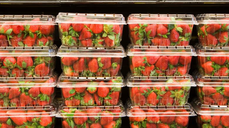 Containers of strawberries in store