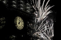 <p>Fireworks explode over the River Thames behind the Elizabeth Tower which contains the bell know as “Big Ben”, at the Houses of Parliament in London, as New Year’s celebrations take place after midnight, Monday, Jan. 1, 2018. Scaffolding stands erected around the Elizabeth Tower for repairs, with the last extensive conservation works taking place more than 30 years ago. (Photo: Matt Dunham/AP) </p>