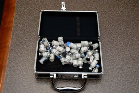 A locked case containing bottles of Tramodol uncovered by U.S. federal investigators in the home of U.S. Coast Guard lieutenant Christopher Paul Hasson in Silver Spring, Maryland, U.S., is shown in the photo provided February 20, 2019. U.S. Attorney's Office Maryland/Handout via REUTERS