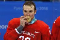 Ice Hockey - Pyeongchang 2018 Winter Olympics - Men's Final Match - Russia - Germany - Gangneung Hockey Centre, Gangneung, South Korea - February 25, 2018 - Olympic Athlete from Russia Andrei Zubarev kisses his gold medal. REUTERS/Grigory Dukor