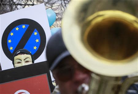 People take part in a symbolic funeral procession and an anti-EU rally near the EU Delegation building in Ukraine in Kiev November 28, 2013. REUTERS/Gleb Garanich