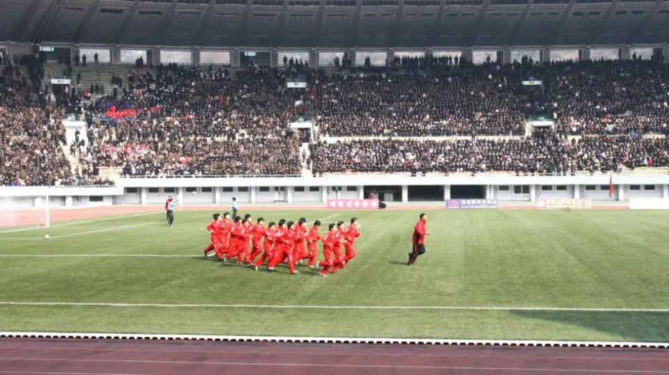 North Korea women warm up at the Kim Il-sung Stadium in Pyongyang before an 8-0 win over Taiwan in April 2007