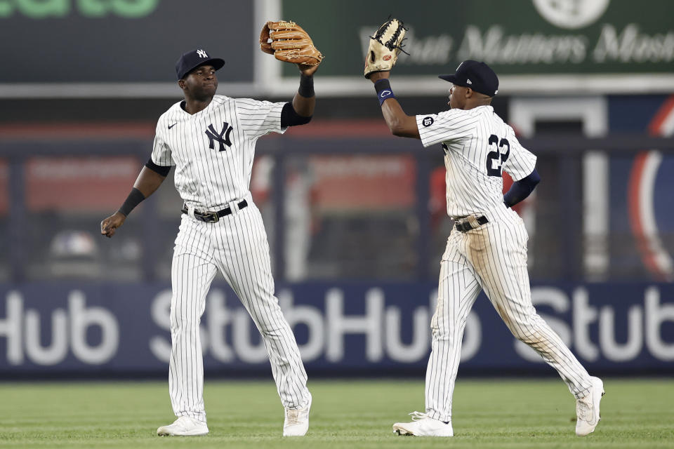 New York Yankees center fielder Estevan Florial celebrates with left fielder Greg Allen (22) after the Yankees defeated the Philadelphia Phillies 6-4 in a baseball game Tuesday, July 20, 2021, in New York. (AP Photo/Adam Hunger)