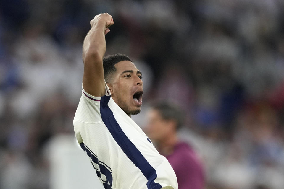 England's Jude Bellingham celebrates at the end of the round of sixteen match between England and Slovakia at the Euro 2024 soccer tournament in Gelsenkirchen, Germany, Sunday, June 30, 2024. (AP Photo/Antonio Calanni)