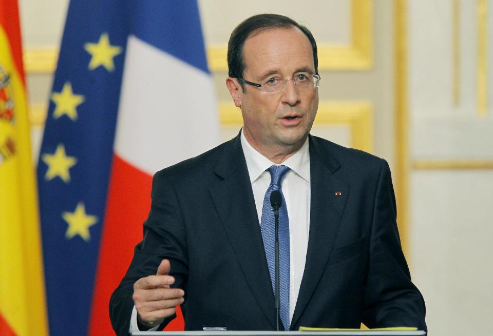 French President Francois Hollande reacts during the meeting with Spain's Prime Minister Mariano Rajoy, unseen, in Elysee Palace, Paris, Wednesday, May 23, 2012. (AP Photo/Jacques Brinon)