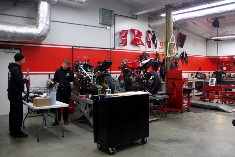 A proper motorcycle shop: clean, organized, and well lit.