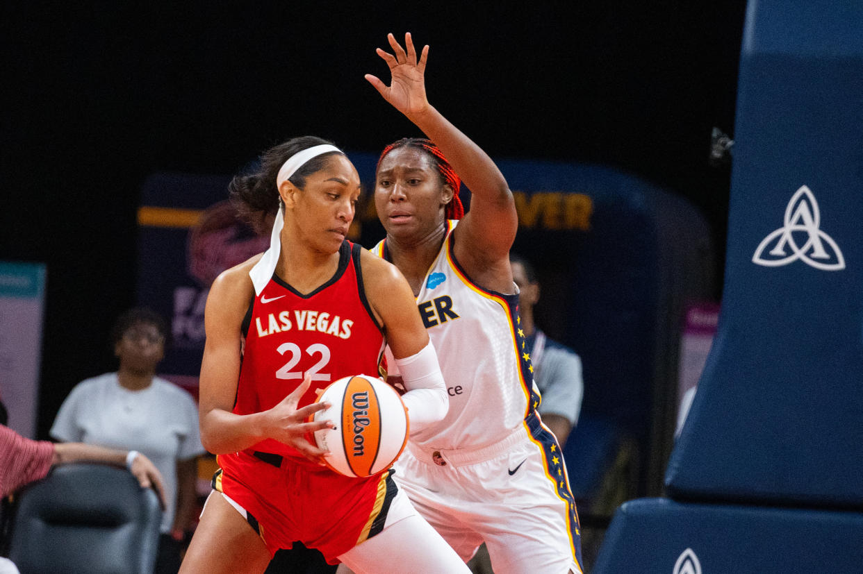 Las Vegas Aces forward A'ja Wilson drives to the basket while Indiana Fever center Aliyah Boston defends during a June game at Gainbridge Fieldhouse in Indianapolis. (Trevor Ruszkowski/USA TODAY Sports)