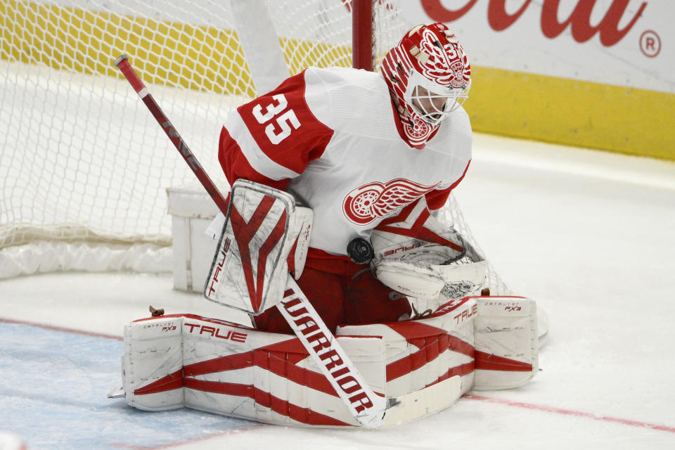Detroit Red Wings goaltender Ville Husso (35) stops the puck during the second period of an NHL hockey game against the Washington Capitals, Monday, Dec. 19, 2022, in Washington. (AP Photo/Nick Wass)