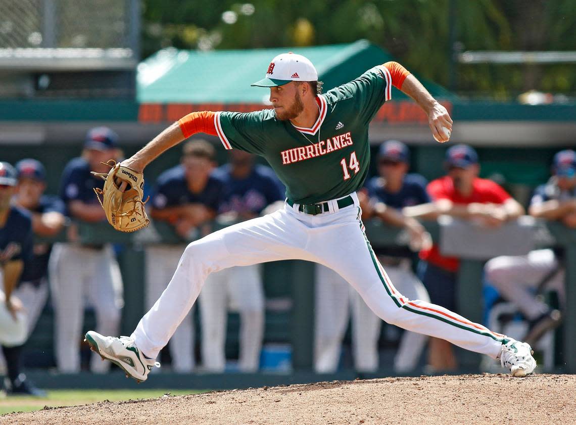 UM Hurricanes starting pitcher Carson Palmquist (14) delivers a pitch during the NCAA baseball regional game against Ole Miss Rebels on Sunday, June 5, 2022 at Alex Rodriguez Park at Mark Light Field in Coral Gables. Andrew Uloza / for THE MIAMI HERALD