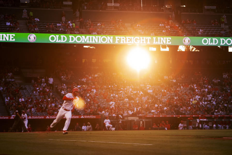 Los Angeles Angels' Jared Walsh heads to first after hitting a double during the second inning of the team's baseball game against the Detroit Tigers in Anaheim, Calif., Saturday, June 19, 2021. (AP Photo/Kyusung Gong)