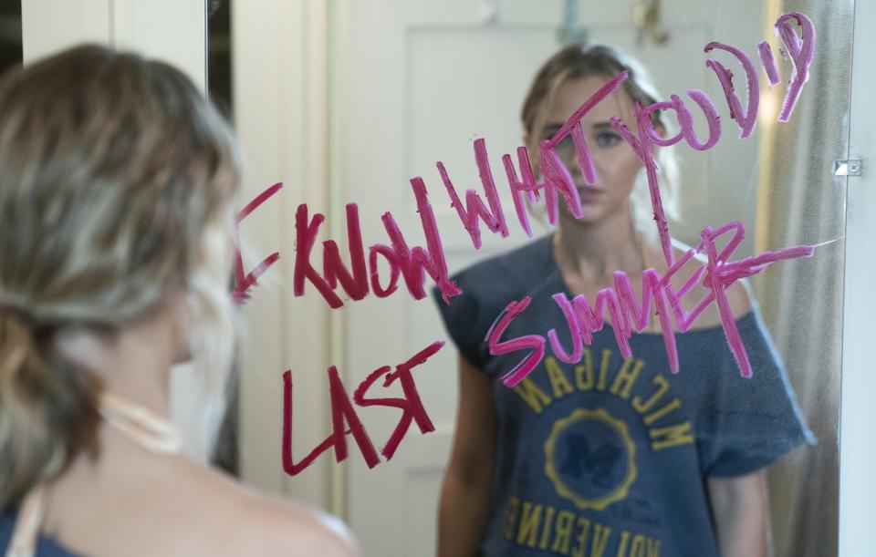 Madison Iseman looking in mirror seeing "I know what you did last summer" written across