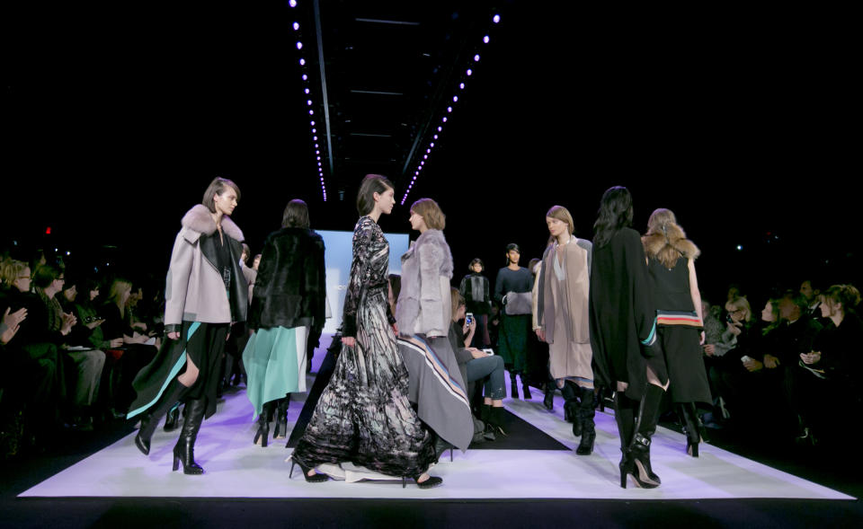 Models walk in the finale of the Fall 2014 BCBG Max Azria collection during Fashion Week in New York, Thursday, Feb. 6, 2014. (AP Photo/Richard Drew)