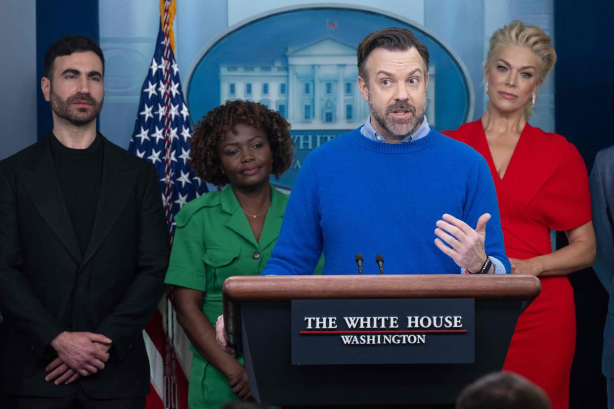 Brett Goldstein, from left, White House Press Secretary Karine Jean-Pierre and Hannah Waddingham look on as Jason Sudeikis, center, speaks during the daily briefing in the James S Brady Press Briefing Room of the White House on March 20, 2023.