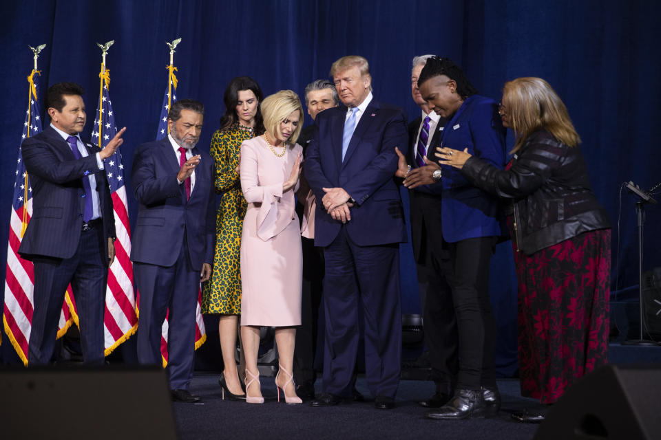 Faith leaders, including Maldonado (far left), pray over Trump during an "Evangelicals for Trump" coalition launch at King Jesus International Ministry on Jan. 3, 2020. (Photo: AP Photo/Evan Vucci)