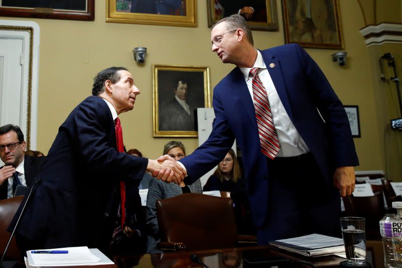 Rep. Raskin shakes hands with House Judiciary Committee ranking member Rep. Collins during a House Rules Committee hearing on the impeachment against President Donald Trump in Washington