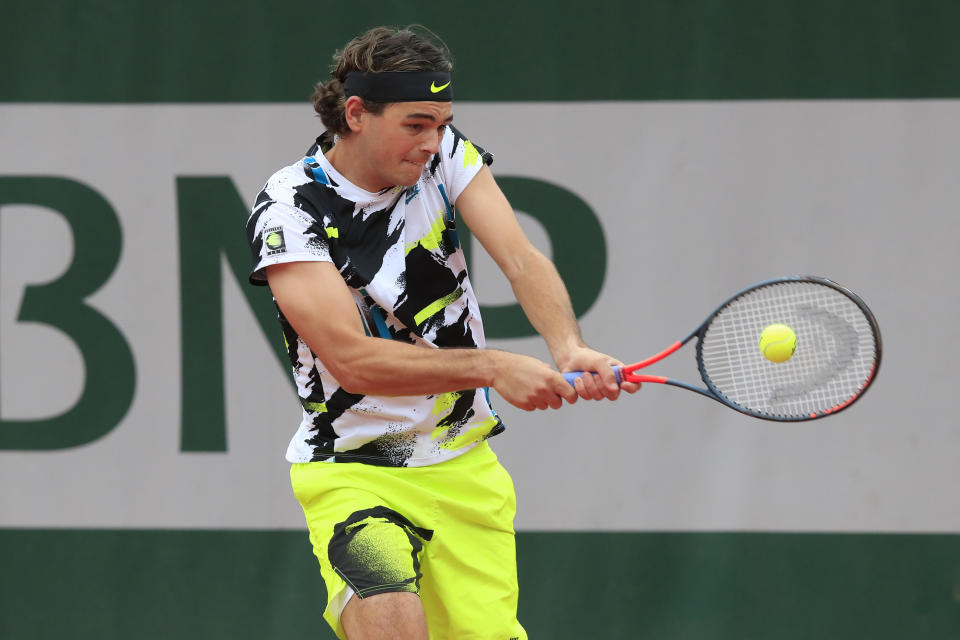 Taylor Fritz of the U.S. plays a shot against Tomas Machac of the Czech Republic in the first round match of the French Open tennis tournament at the Roland Garros stadium in Paris, France, Sunday, Sept. 27, 2020. (AP Photo/Michel Euler)