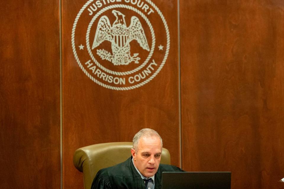 Judge Brandon Ladner talks with witnesses and defendants over a zoom call during an initial hearing for three men, who are charged with murder at a residence in Gaston Point over New Year’s Eve, at Harrison County Justice Court in Gulfport on Wednesday, Jan. 19, 2022.