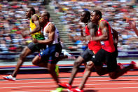 LONDON, ENGLAND - AUGUST 04: (L-R) Usain Bolt of Jamaica and James Dasaolu of Great Britain compete in the Men's 100m Round 1 Heats on Day 8 of the London 2012 Olympic Games at Olympic Stadium on August 4, 2012 in London, England. (Photo by Stu Forster/Getty Images)