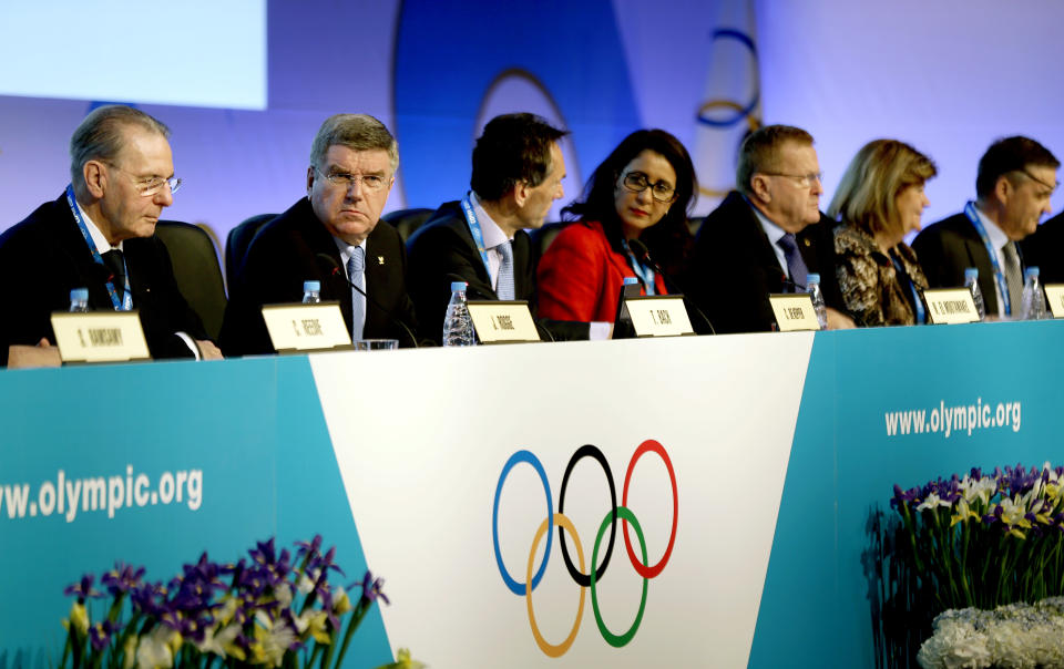 International Olympic Committee President Thomas Bach, second from left, opens the IOC's general assembly at the 2014 Winter Olympics, Wednesday, Feb. 5, 2014, in Sochi, Russia. (AP Photo/David Goldman)