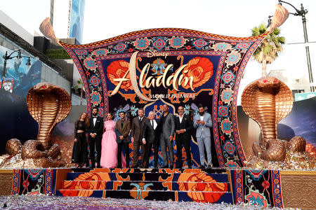 (L-R) Nasim Pedrad, Marwan Kenzari, Naomi Scott, Mena Massoud, director Guy Ritchie, Alan Menken, Will Smith, Navid Negahban and Numan Acar attend the premiere of "Aladdin" at El Capitan theatre in Los Angeles, California, U.S. May 21, 2019. REUTERS/Mario Anzuoni