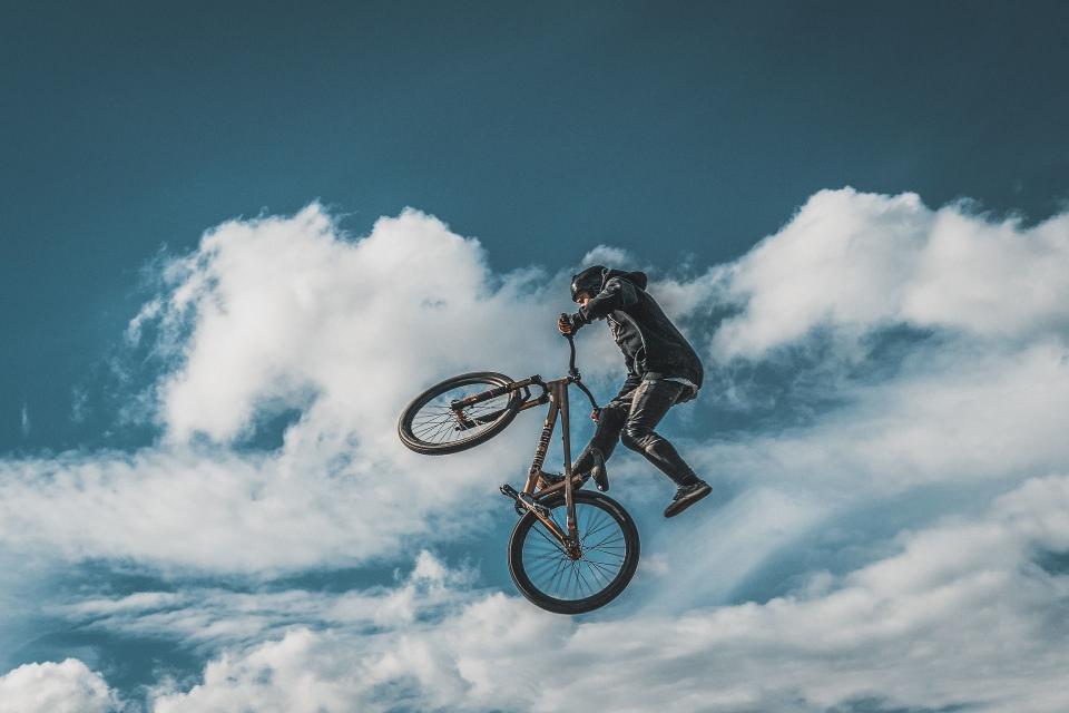 Aerial shot of a cyclist against a cloudy background