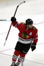Chicago Blackhawks left wing Alex DeBrincat celebrates after scoring a goal during the first period of an NHL hockey game against the Dallas Stars in Chicago, Sunday, May 9, 2021. (AP Photo/Nam Y. Huh)