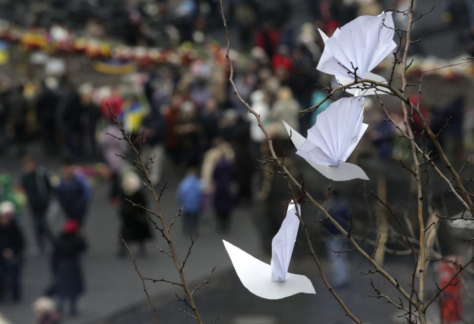 A view of a paper installation depicting white pigeons at a make-shift memorial for those killed in recent violence in Kiev