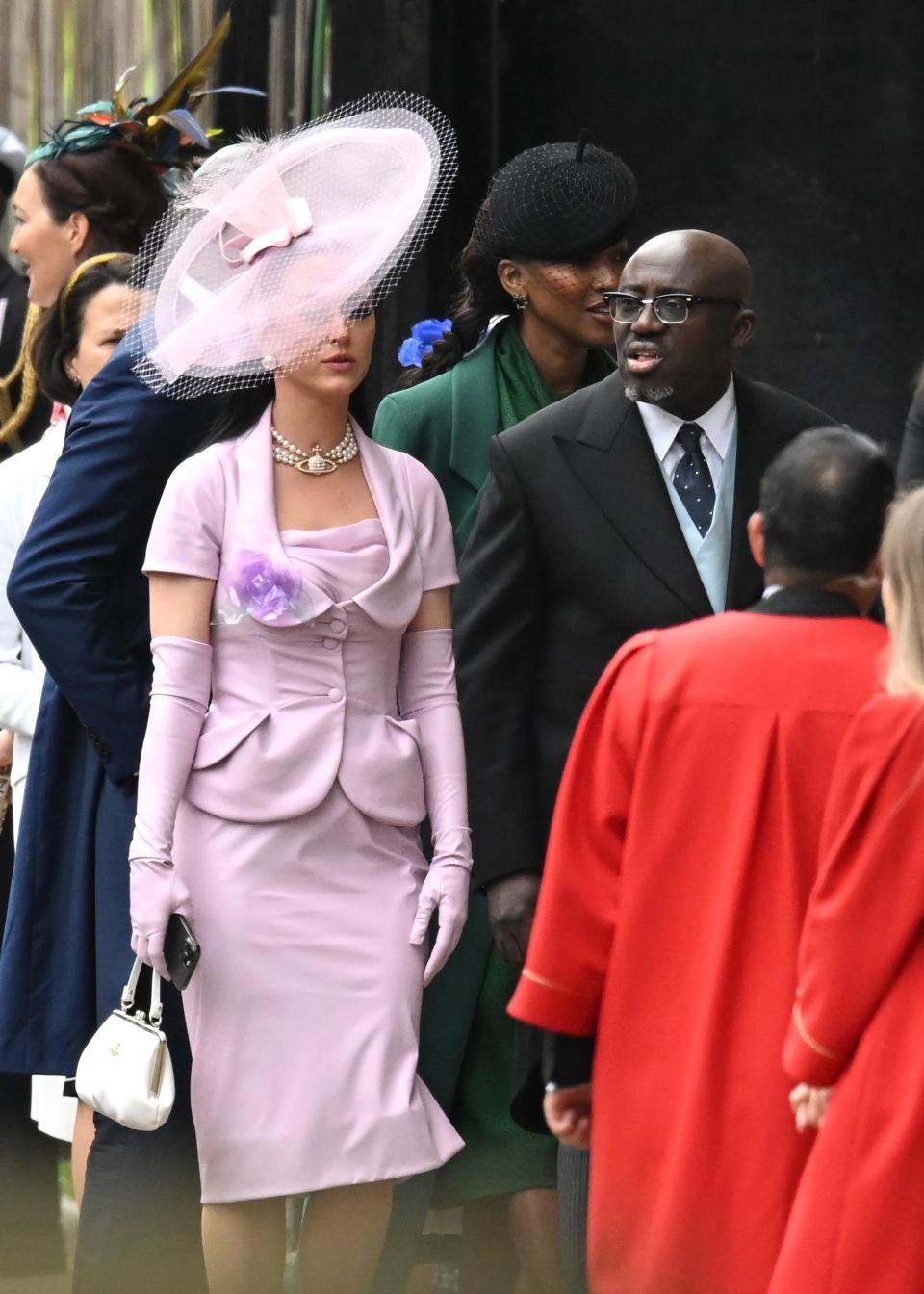 Katy Perry and British Vogue editor-in-chief Edward Enninful arrive at Westminster Abbey ahead of the coronation of King Charles III and Queen Camilla on May 6, 2023 in London, England.