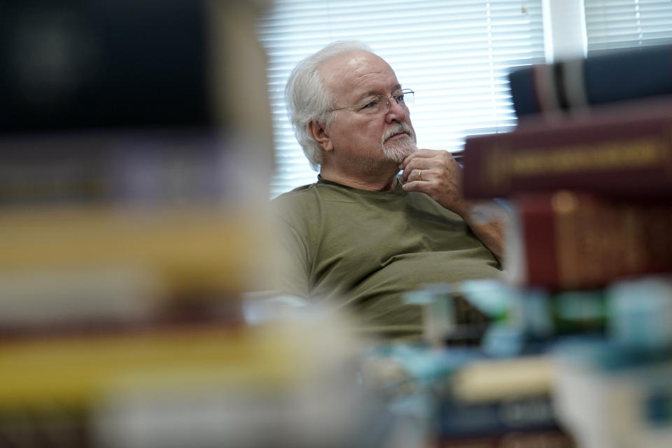 FILE - Paul Phelps, 76, of Alexandria, Va., works in the genealogy room at Hollin Hall Senior Center in Alexandria, Va., Thursday, Oct. 13, 2022. The news that 70 million people will see an 8.7% boost in their Social Security checks comes just weeks before the midterm elections, but it's unlikely to give Democrats the edge they're desperately seeking at the polls Nov. 8. (AP Photo/Susan Walsh, File)