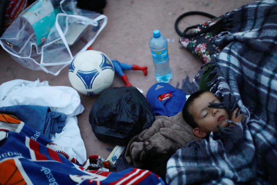 A child traveling with a caravan of migrants from Central America sleeps near the San Ysidro checkpoint.