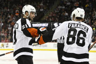 Philadelphia Flyers center Scott Laughton, left, celebrates his goal with left wing Joel Farabee (86) during the second period of an NHL hockey game against the New Jersey Devils, Thursday, Dec. 15, 2022, in Newark, N.J. (AP Photo/Bill Kostroun)