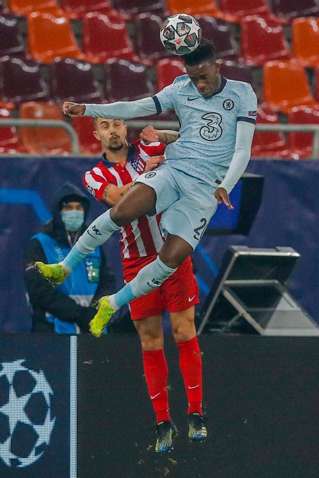 Callum Hudson-Odoi, right, wins a header