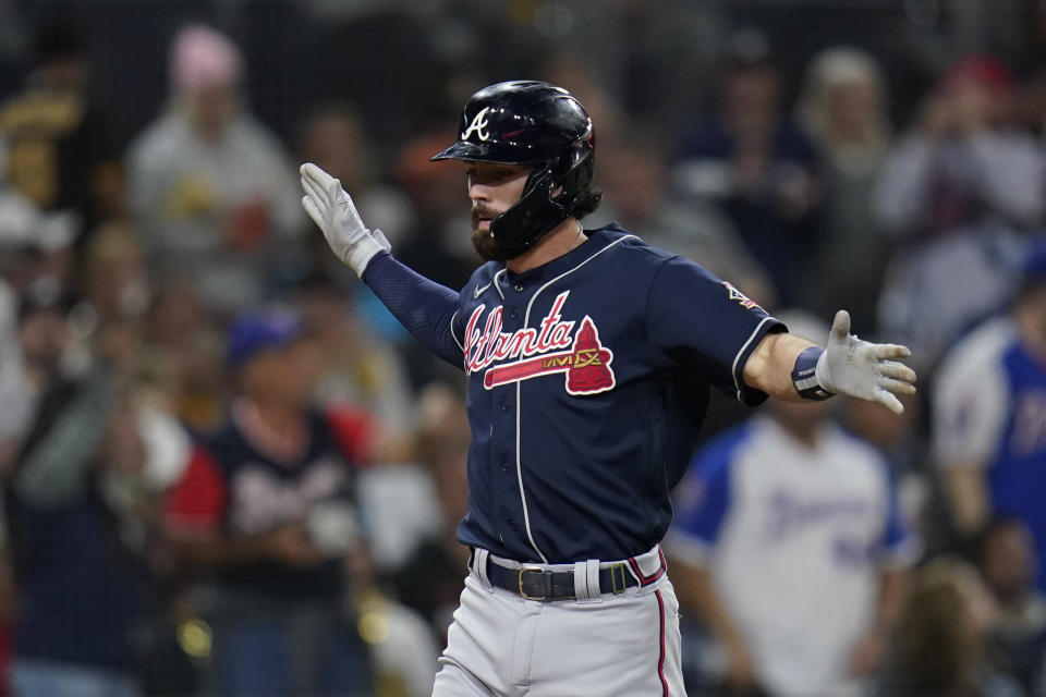 Atlanta Braves' Dansby Swanson reacts after hitting a two-run home run during the second inning of a baseball game against the San Diego Padres, Friday, Sept. 24, 2021, in San Diego. (AP Photo/Gregory Bull)