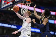 Wake Forest guard Cameron Hildreth shoots in front of Notre Dame forward Carey Booth during the second half of an NCAA college basketball game in the second round of the Atlantic Coast Conference tournament, Wednesday, March 13, 2024, in Washington. (AP Photo/Nick Wass)