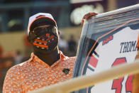 Hall of Fame running back Thurman Thomas is honored as the first inductee into the Oklahoma State football Ring of Honor at half time of an NCAA college football game against West Virginia, Saturday, Sept. 26, 2020, in Stillwater, Okla. (AP Photo/Brody Schmidt)