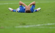 Italian midfielder Claudio Marchisio reacts on the ground during the Euro 2012 championships football match Spain vs Italy on June 10, 2012 at the Gdansk Arena. AFP PHOTO/ GIUSEPPE CACACEGIUSEPPE CACACE/AFP/GettyImages