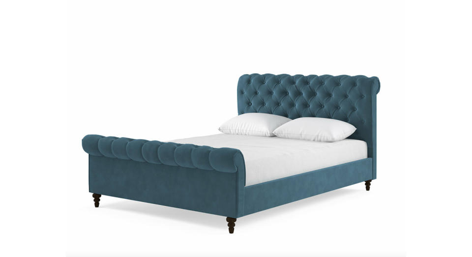 This Ottoman velvet bed frame is a discreet storage solution.  