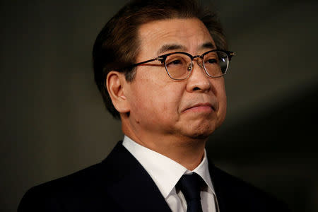 National Intelligence Service chief Suh Hoon listens as South Korea's National Security Office head Chung Eui-yong makes an announcement about North Korea and the Trump administration outside of the West Wing at the White House in Washington, U.S. March 8, 2018. REUTERS/Leah Millis