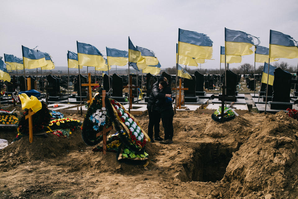 In the village of Mala Rohan, mourners attend the funeral of Artur Shchukin, who died March 25<span class="copyright">Maxim Dondyuk—Der Spiegel</span>