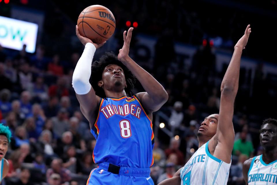 Oklahoma City Thunder forward Jalen Williams (8) is fouled by Charlotte Hornets guard Theo Maledon (9) during an NBA basketball game between the Oklahoma City Thunder and the Charlotte Hornets at Paycom Center in Oklahoma City, Tuesday, March 28, 2023. The Hornets won 137-134.