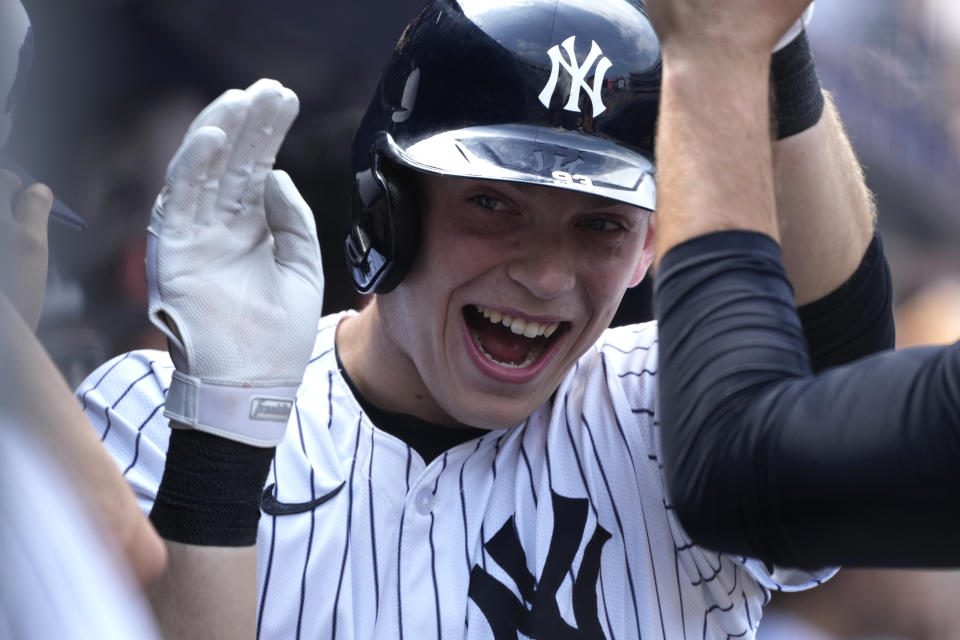 New York Yankees' Ben Rice celebrates in the dugout after hitting a home run during the fifth inning of a baseball game against the Cincinnati Reds, Thursday, July 4, 2024, in New York. (AP Photo/Pamela Smith)