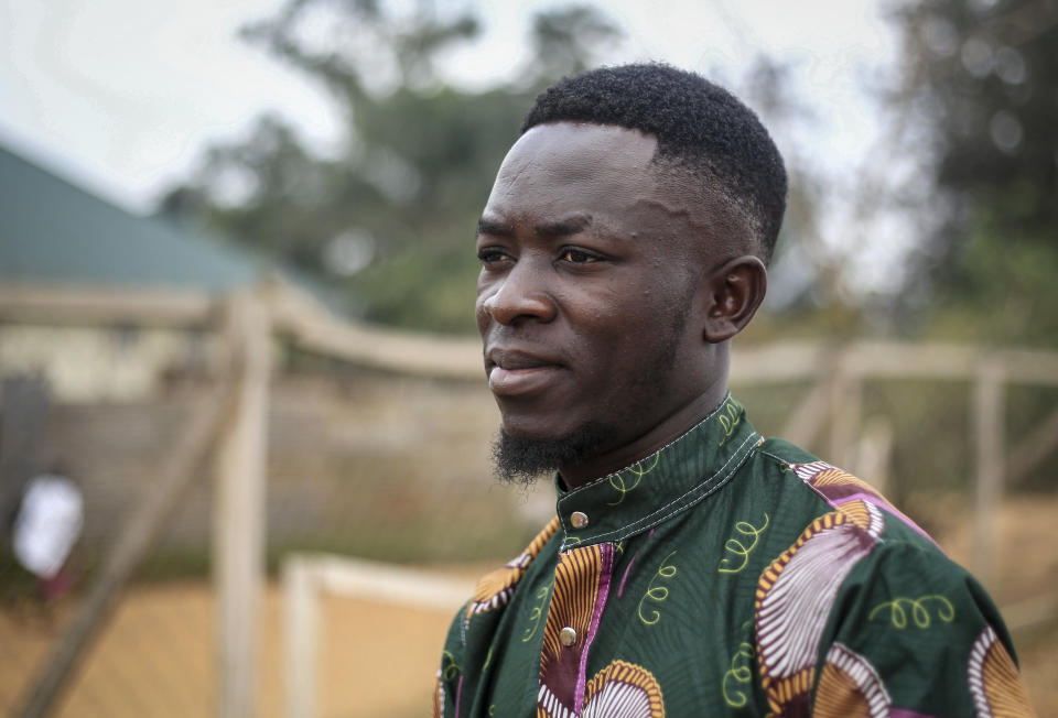 Motorcycle taxi driver Germain Kalubenge is photographed at an Ebola transit center where potential cases are evaluated, in Beni, Congo, Thursday, Aug. 22, 2019. Kalubenge is a rare motorcycle taxi driver who is also an Ebola survivor in eastern Congo, making him a welcome collaborator for health workers who have faced deep community mistrust during the second deadliest Ebola outbreak in history. (AP Photo/Al-hadji Kudra Maliro)