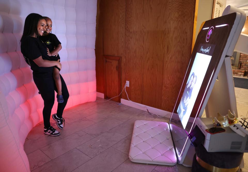 Brockton's Kelly Alves, owner of Zion's Photo Booths, holds her son Zion, 3, on Tuesday, June 21, 2022.