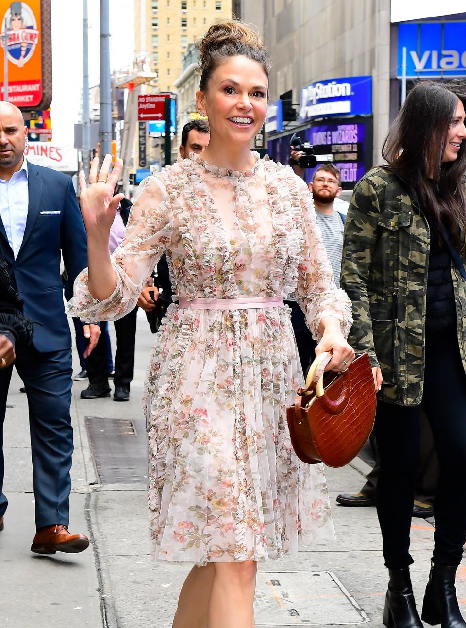 <em>Younger</em>'s Sutton Foster makes her way into <em>Good Morning America </em>in N.Y.C. on Tuesday in a floral-print dress. 