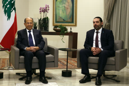 Lebanon's President Michel Aoun and Prime Minister-designate Saad al-Hariri meet ahead of a new government announcement at the presidential palace in Baabda, Lebanon January 31, 2019. REUTERS/Mohamed Azakir