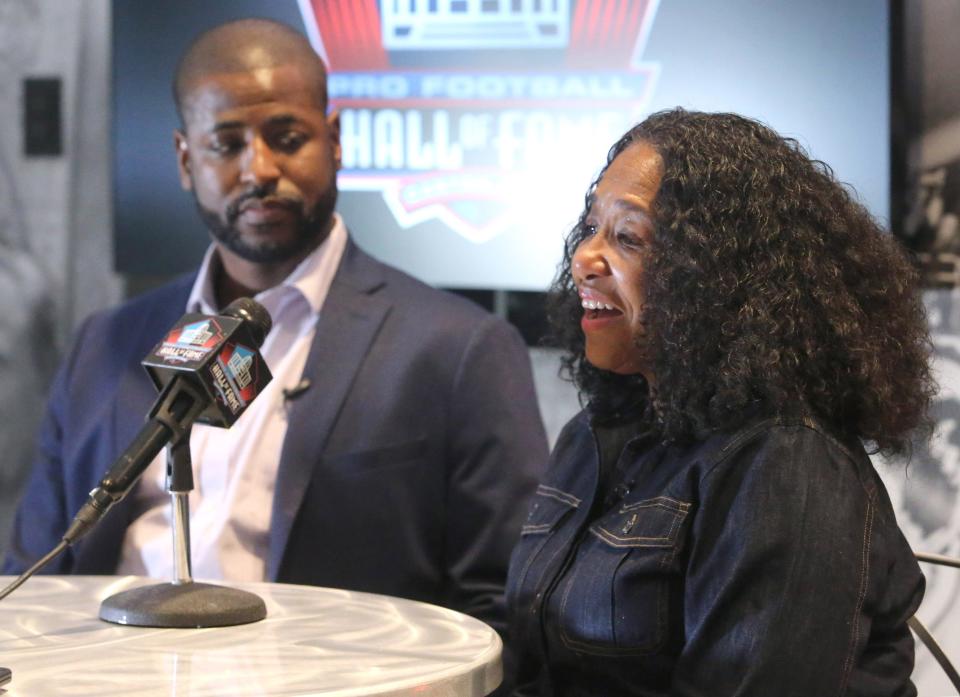 Marcus Mills and Melanie Mills, the son and wife of the late Sam Mills Jr., speak to the media at the Pro Football Hall of Fame in Canton on Monday, March 14, 2022. Sam Mills Jr. is a member of the Class of 2022.